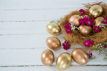 Golden Easter eggs in the nest