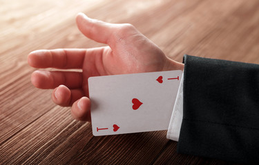 Business man with ace in his sleeve.