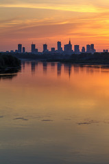 Evening panorama of Warsaw skyline over Vistula river at sunset, Poland