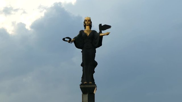 Monument of Saint Sofia, the goddess protector of the city, Sofia, Bulgaria. Dark stormy clouds before rain.