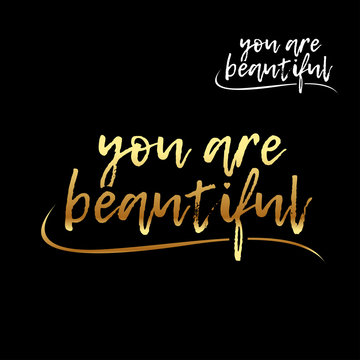 You are beautiful golden letters card. Hand drawn lettering background. Ink illustration. Modern brush calligraphy. Isolated on black background. Compliment for women.