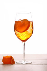 aperol spritz cocktail with orange isolated on wood table