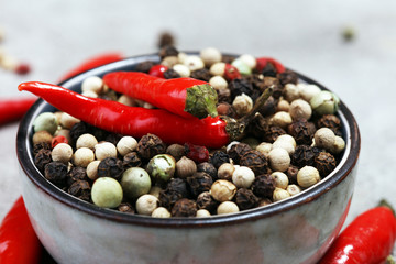 red hot bird chili pepper with pepper corns