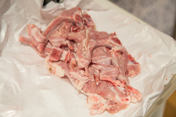 Uncooked raw lamb chops on top of a table. 