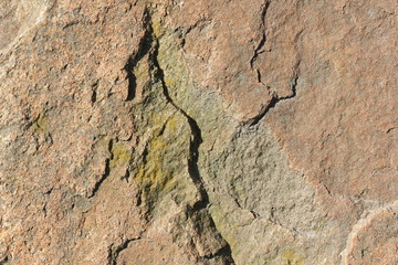 Natural stone granite texture, granite pattern. Stone background of mottled granite igneous rock used for kitchen worktops etc. Surface of the marble with brown tint. Minimalism