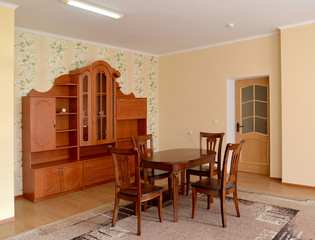 Living room interior with wooden brown furniture