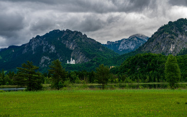 Fototapeta na wymiar Berge mit Wolken und Wald in Schwangau in Bayern dem Land der Königsschlösser