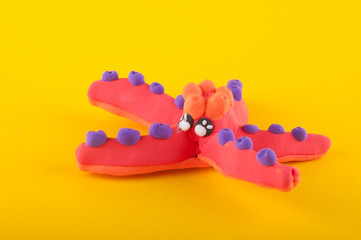Plakat Starfish made of modelling clay laying on yellow background