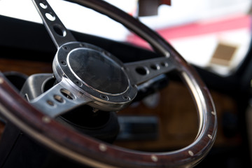 Interior view of classic vintage car. Beautiful retro car, interior elements, chrome and wood, the concept of expensive collector cars, premium class