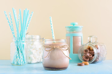 Photo of cocoa in a high key. Blurred background. Beige turquoise colors on the photo.