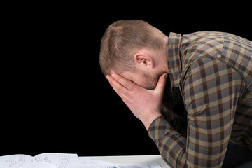 Obraz premium Busy man investment consultant analyzing company annual financial report balance sheet statement. Worried corporate employee working with documents graphs. Stock market, office, tax, economy concept