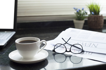 newspaper at office desk