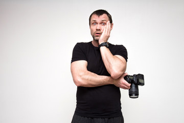 Portrait of a cute photographer on a white background