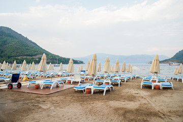 Fototapeta na wymiar Sun loungers on a beach in Turkey
