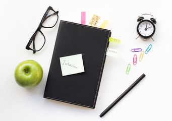 Notepad with sticky note 