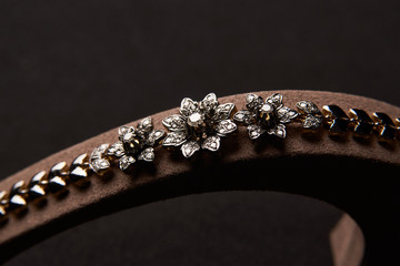Diamond Women's Wristband. Beautiful luxury bracelet jewellery with gemstone diamonds, close-up. Selective focus