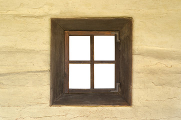 Old wooden window on a clay wall