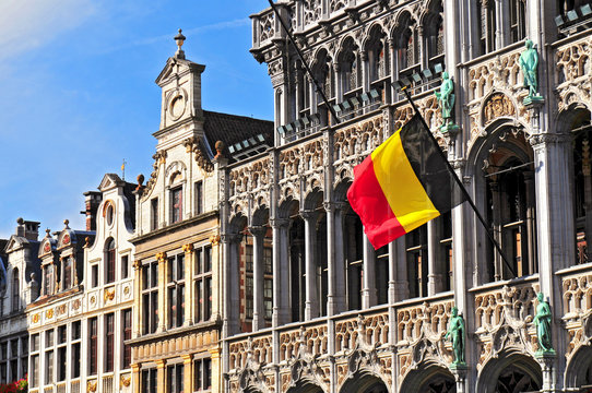 Belgian flag on the Grand Place Broodhuis in Brussels.