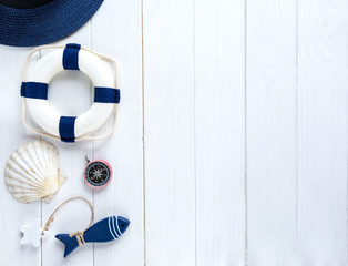 summer travel vacation concept flat lay, space for text. passport plane hat phone with empty screen and sunglasses and shells on white wooden background. hello summer.