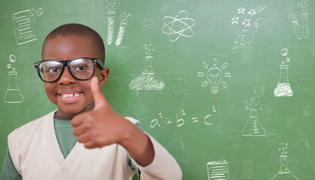 Cute pupil showing thumbs up against school doodles