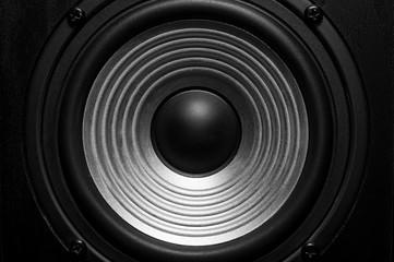 Frontal image of audio speaker with wavy membrane.