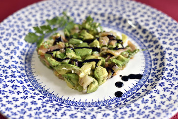 Preparation of a salmon tartar with avocado