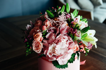 Gift flower box made of pink blooming flowers