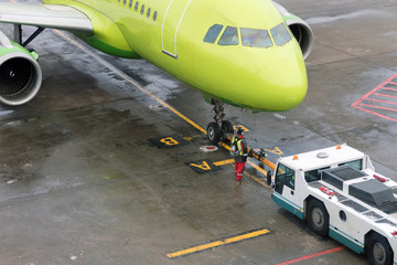 Towing the aircraft from the runway to the Parking lot with the help of special equipment.