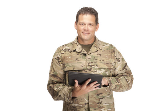 U.S. Army Soldier, Sergeant. Isolated with digital tablet.