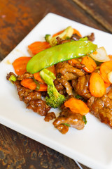 Beef tenderloin with vegetables, chinese food on a white plate. - 202999489