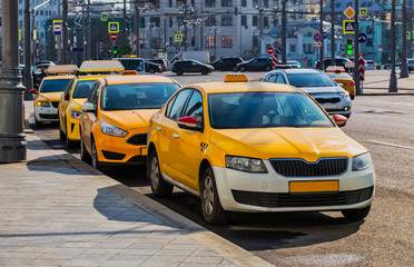 lots of yellow taxis in the Parking lot