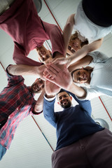 Team of businesspeople forming hand stack