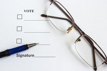 Form for voting and signing near the pen, glasses