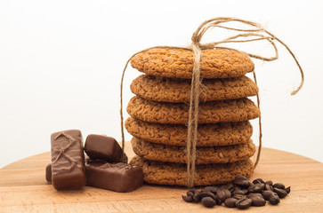 Oatmeal cookies on a wooden board, white background
