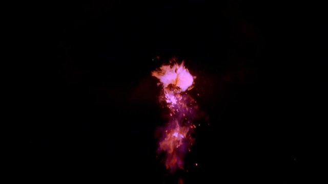 Rosy cloud explosion with flames and debris