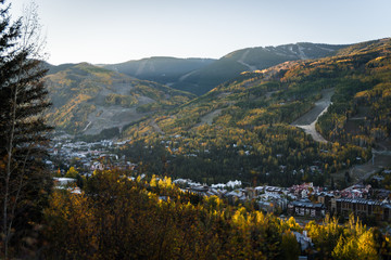 Vail Colorado lit up during sunrise in autumn.  - obrazy, fototapety, plakaty