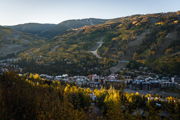 Vail Colorado lit up during sunrise in autumn. 