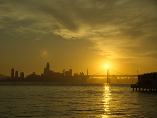 Fototapeta na wymiar Amazing golden glow back lights San Francisco skyline