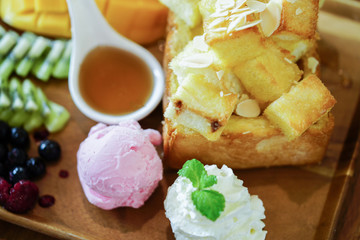 Honey toast and ice cream with Mixed Fruit and caramel.
