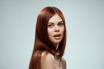 surprised woman with open mouth looks into the camera