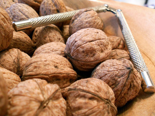 Brown walnuts in a brown bowl
