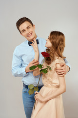 young couple with rose