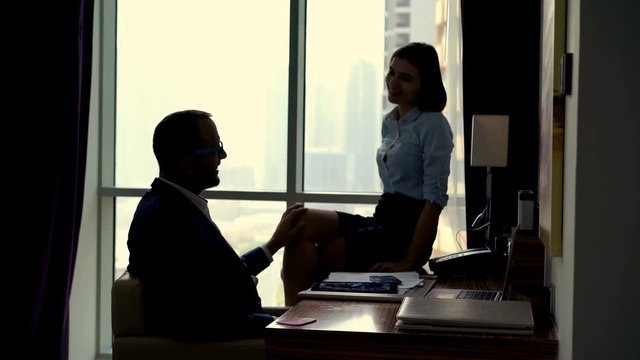 Young business couple are having office affair in the office, 4K
