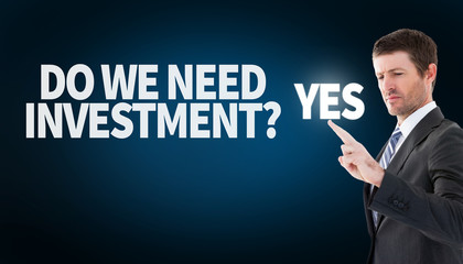 Businessman standing and pointing the finger against blue background with vignette