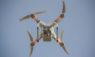 Flying drone photographed from below