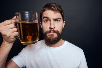 man with glass of beer