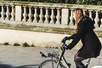 Girl Riding her Bike in Paris, France