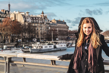 Girl near Seine River in Paris, France