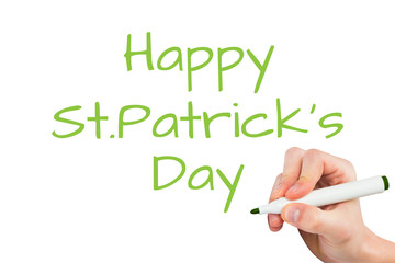 Hand writing with a marker against happy st patricks day