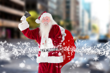 Santa claus ringing bell against new york street